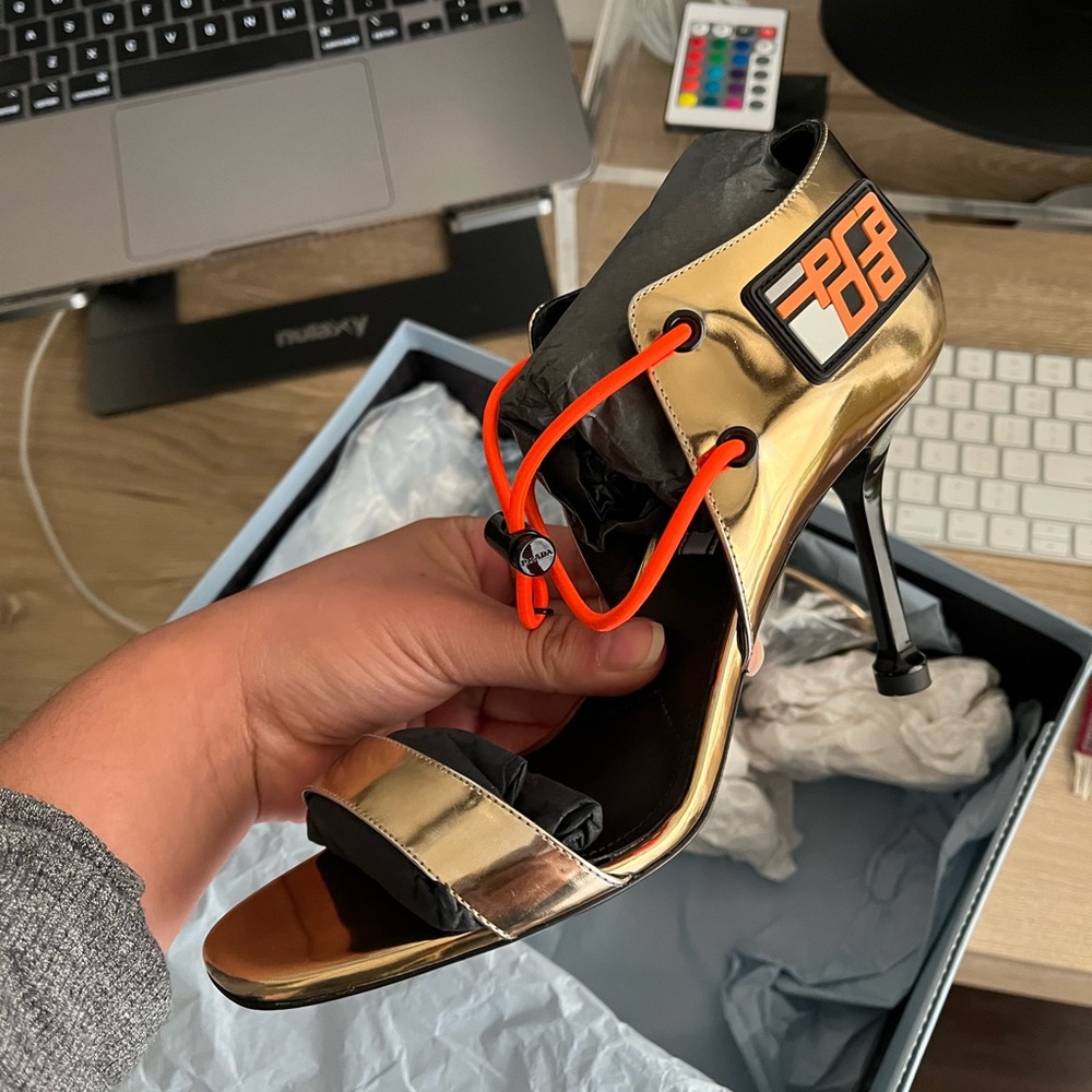 PRADA metallic heels with orange bungee cord